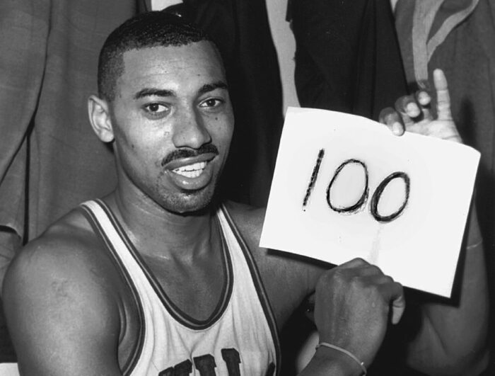 Chamberlain showcased his dominance by scoring 100 points in a single game against the New York Knicks
